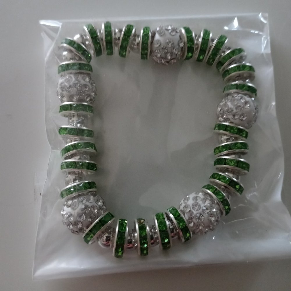 New in package green charm like bracelet
